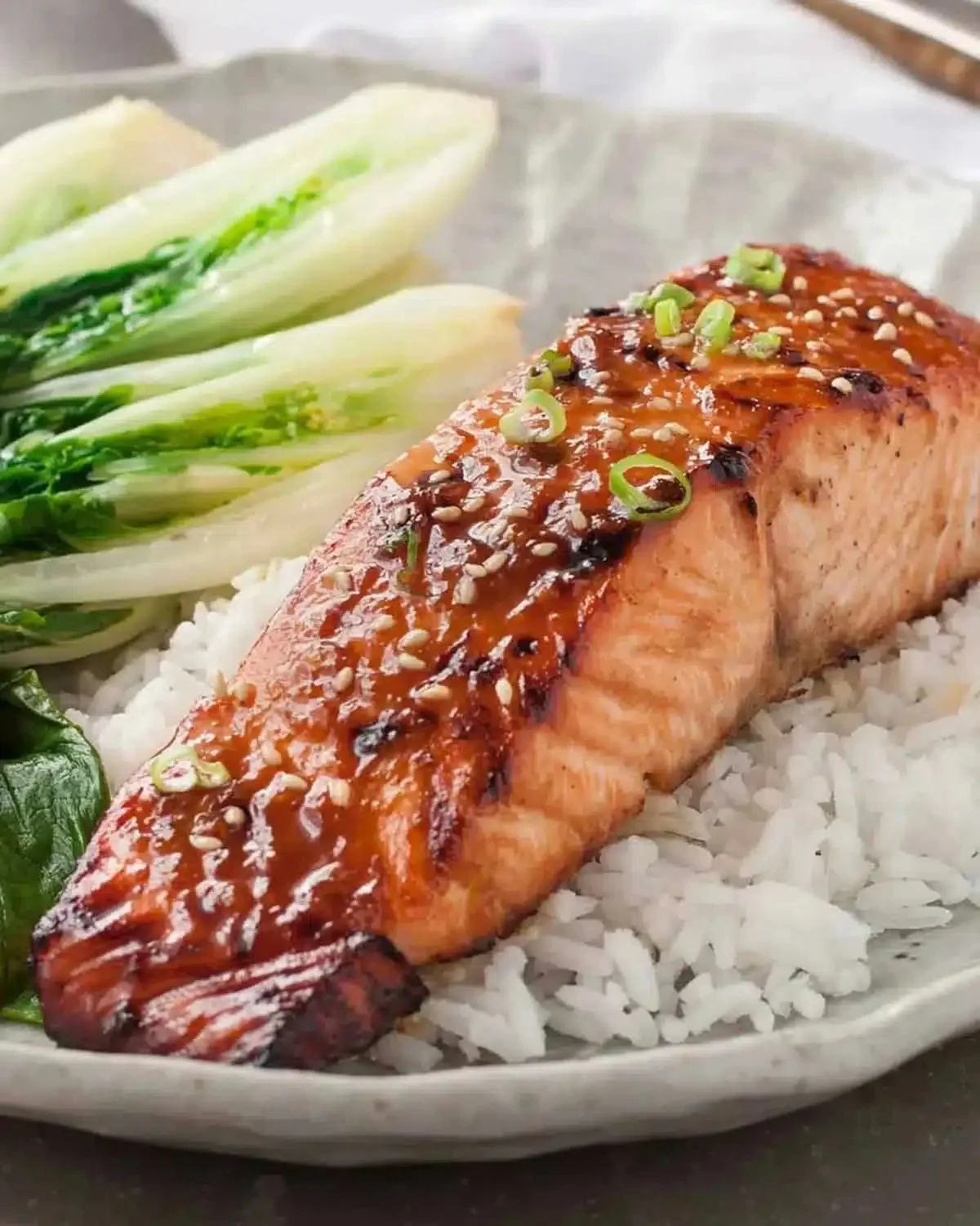 Asian Glazed Salmon | Sticky Maple-Soy Glaze 1 Asian glazed salmon with sticky maple-soy glaze on a plate