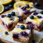Bright Lemon & Blueberry Cheesecake Bars 2 bright lemon blueberry cheesecake bars 2026 03 12 195744 819x1024 1