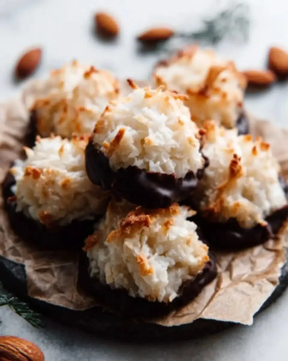 Delicious homemade coconut macaroons, chewy and toasted, served on a plate.