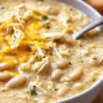 A bowl of quick and easy white chicken chili garnished with cilantro.