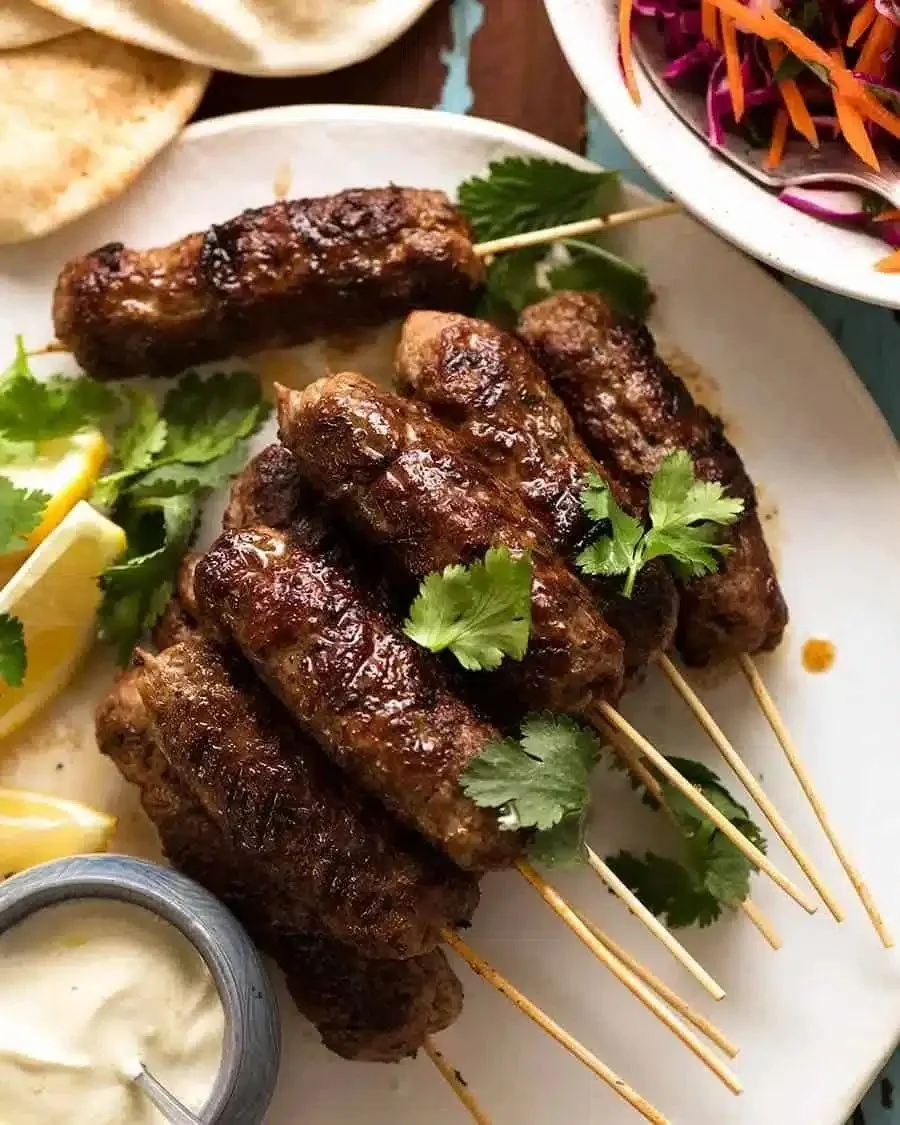 Quick & Flavorful Lamb Koftas 1 Deliciously spiced lamb koftas served with a fresh salad and yogurt sauce.