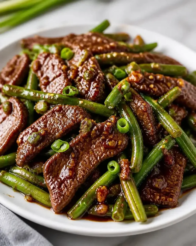 Blackstone-style garlic beef served with vibrant green beans