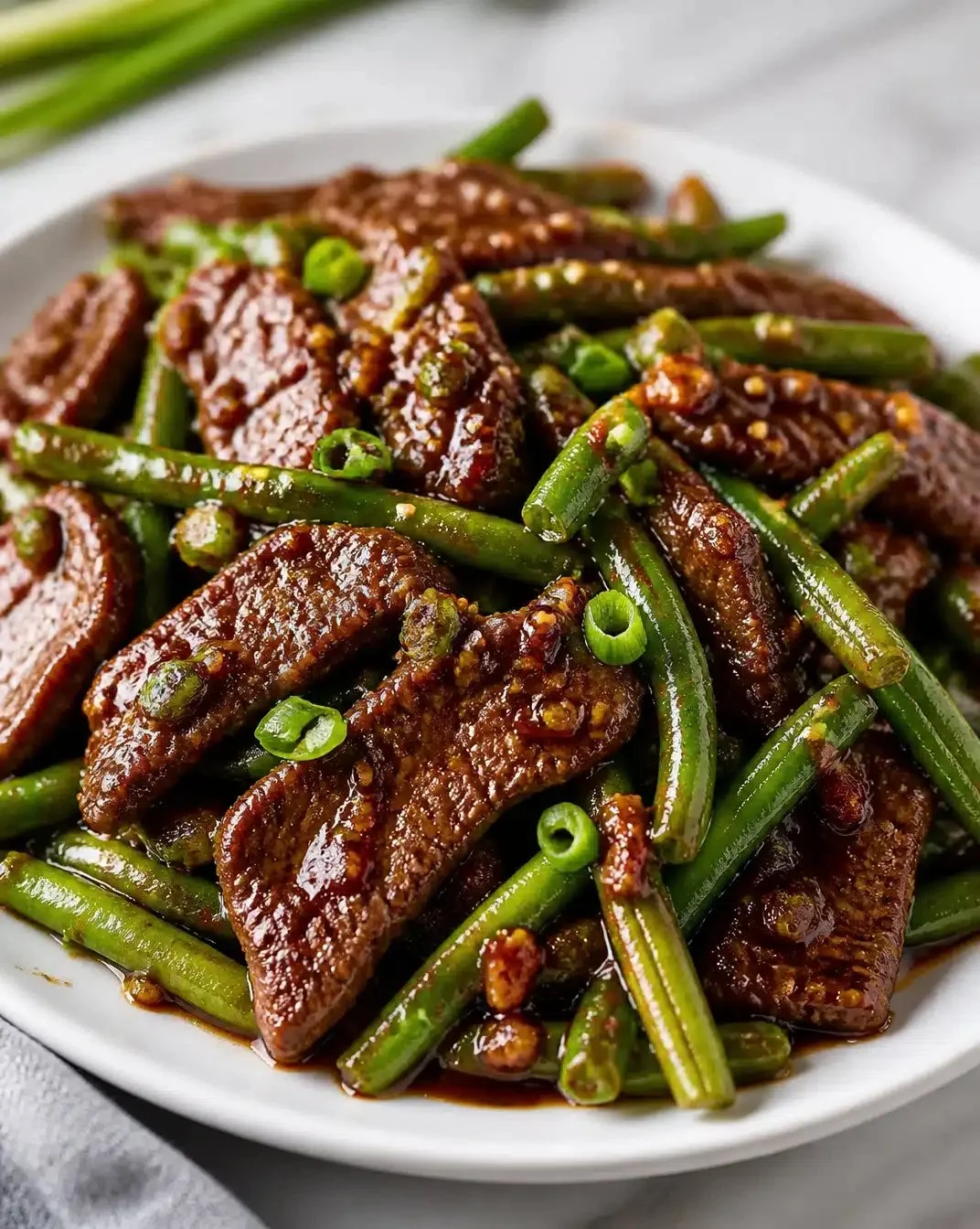Blackstone-Style Garlic Beef with Green Beans 1 Blackstone-style garlic beef served with vibrant green beans