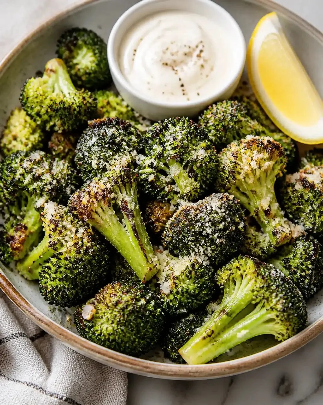 Crispy air fryer garlic parmesan broccoli served in a bowl