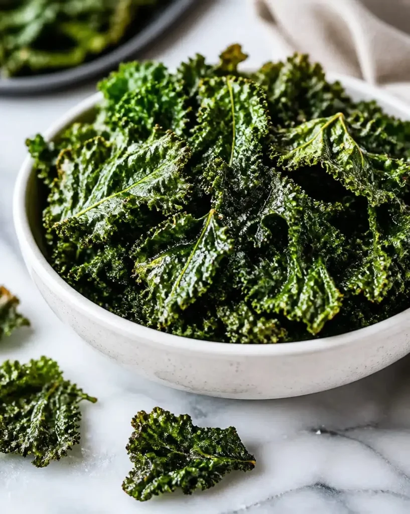 Crispy air fryer kale chips served in a bowl, a healthy snack idea.