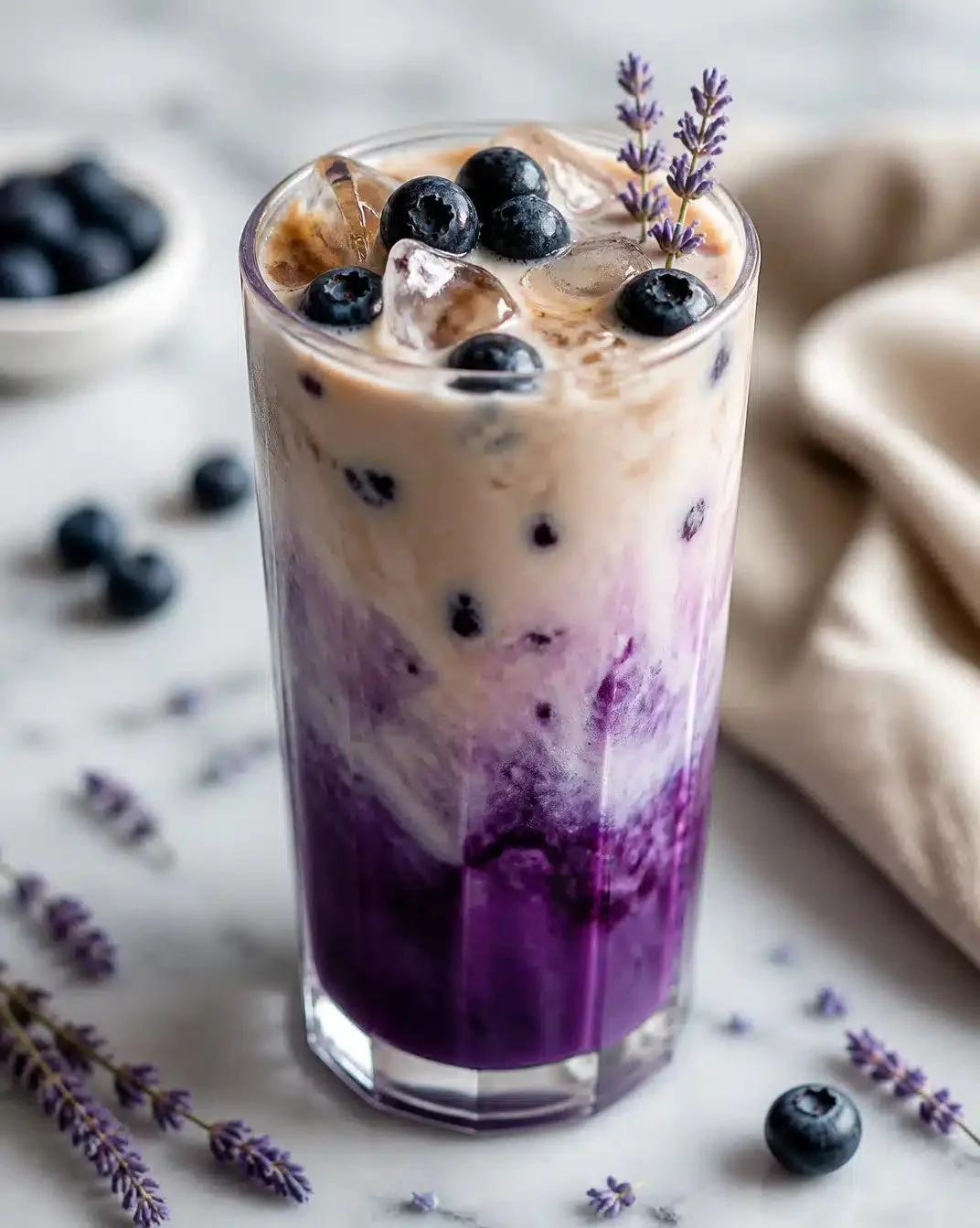 Lavender Blueberry Oat Milk Latte 1 Delicious Lavender Blueberry Oat Milk Latte in a decorative cup