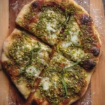 Freshly baked verdant pistachio pesto pie with vibrant green topping.